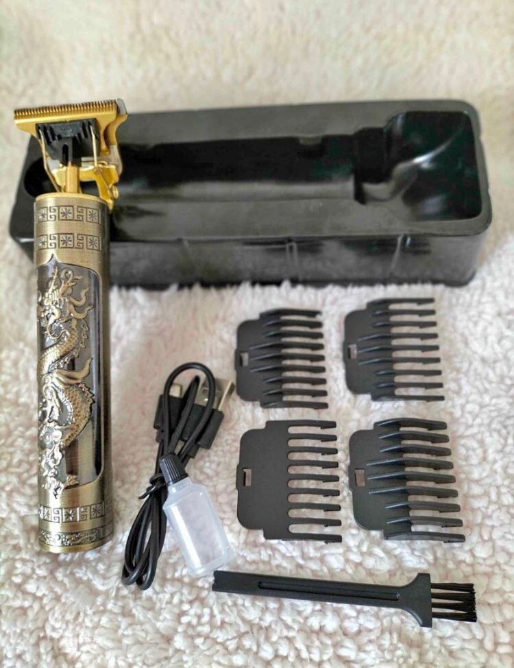 ماشین اصلاح موی سر و صورت خط زن مدل T9 با تیغه استیل ضد زنگ، باتری داخلی، شارژ از طریق USB، مدت استفاده 3 ساعت، همراه برس تمیزکننده، روغن و شانه